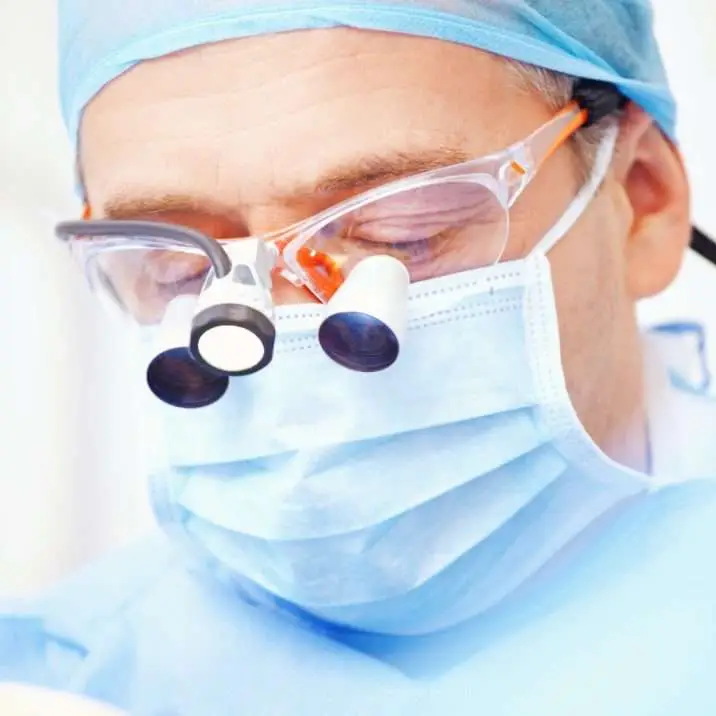 Dental surgeon operating